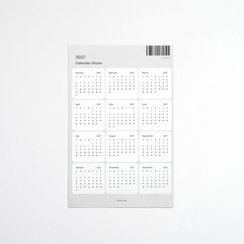 A flat-lay image of the 2027 calendar sticker sheet, displaying all months with clear, minimalist design and fine black printing.