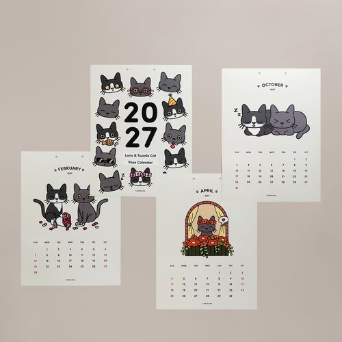 Colorful calendar sheets feature charming cat illustrations with playful expressions, arranged against a neutral background, highlighting their vibrant designs.