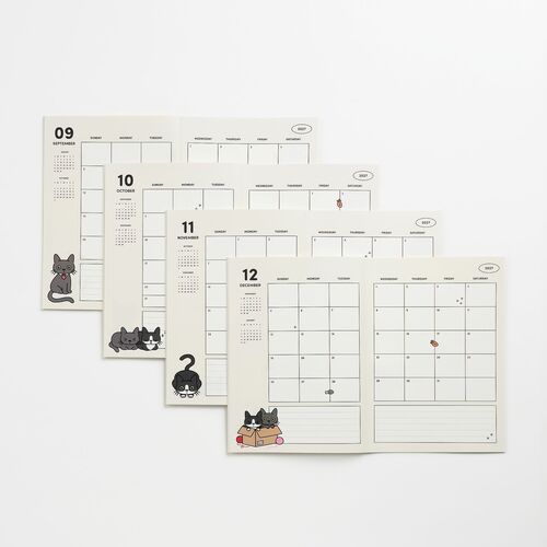 The planner pages feature adorable cat illustrations in black, gray, and pink tones, with clean, organized layouts on crisp white paper.