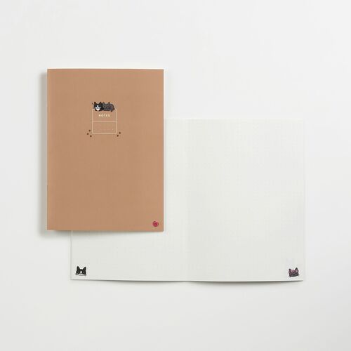 A soft beige cover with adorable Lana & Tuxedo Cat illustrations, paired with a dotted inner page, highlighting playful stationery charm.