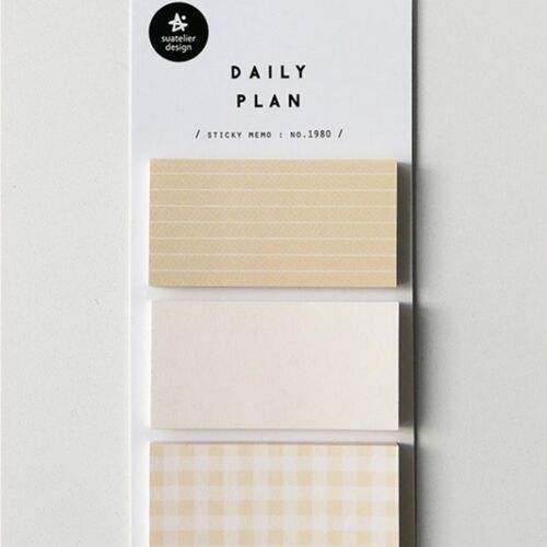 The image features a white backing card displaying three beige sticky notes with different patterns—lined, plain, and checkered—arranged vertically.