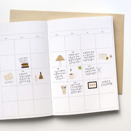 Small, cute stickers featuring cozy stationery and home accessories are arranged on a weekly planner page with soft, warm tones.