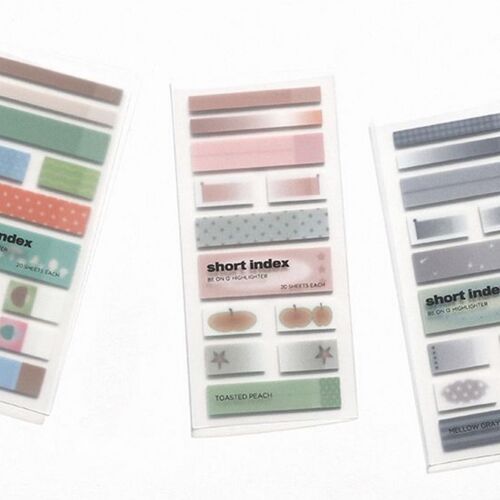 Three transparent plastic sheets display colorful, patterned sticky note strips organized by aesthetic style, showcasing their vibrant designs and writable surfaces.