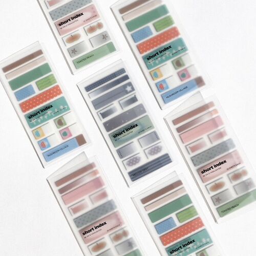 Multiple packs of colorful sticky notes with playful patterns and pastel shades are arranged on a white surface, emphasizing variety and aesthetic appeal.