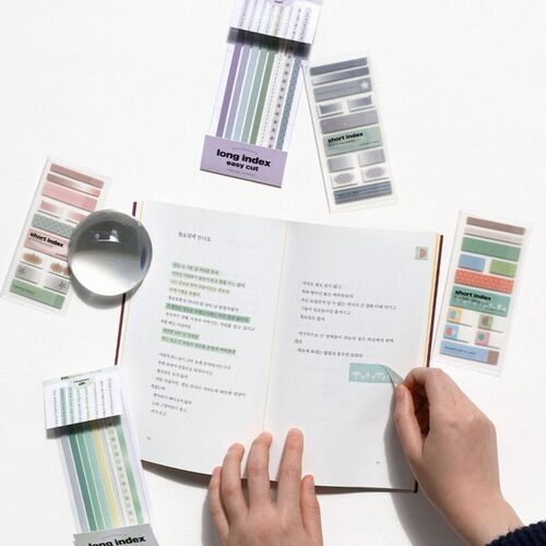 A flat lay showcases colorful sticky notes in pastel shades and patterns, highlighting their decorative and functional versatility for note organization.