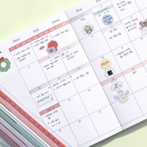 A colorful planner page decorated with various cute stickers, highlighting the product's decorative and functional use in scheduling.