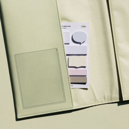 The image showcases a set of pastel-colored sticky notes with various shapes and sizes, arranged on a light-colored surface, emphasizing their aesthetic appeal and versatility.