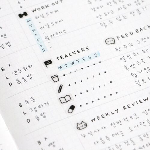 A close-up of a neatly handwritten journal page featuring black ink text, small doodle icons, and light blue highlights, emphasizing organized creativity.