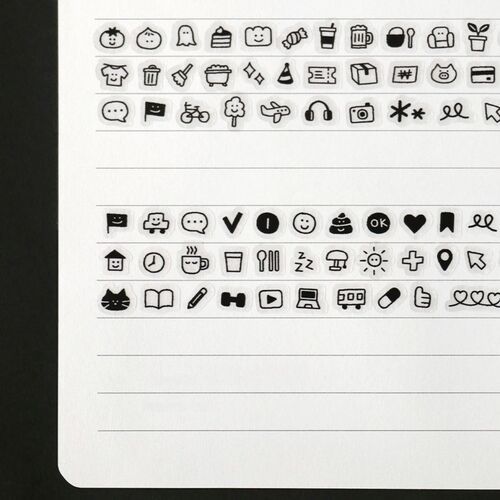 The image showcases black and white doodle stickers with playful icons, neatly arranged on a white sheet with lined sections, highlighting their detailed designs.