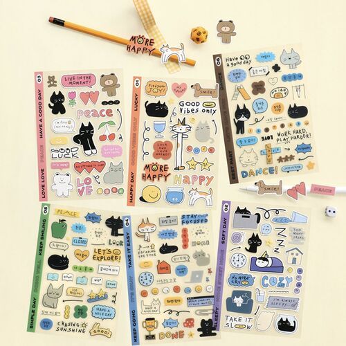 Colorful, whimsical sticker sheets featuring adorable cats, bears, and icons arranged neatly on a light background, emphasizing playful creativity.