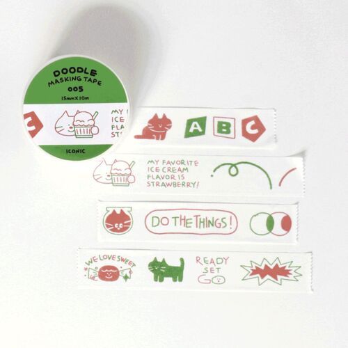 A close-up of the Doodle Masking Tape roll, revealing playful, colorful doodle illustrations on a bright green background, with several decorated strips laid out beneath.