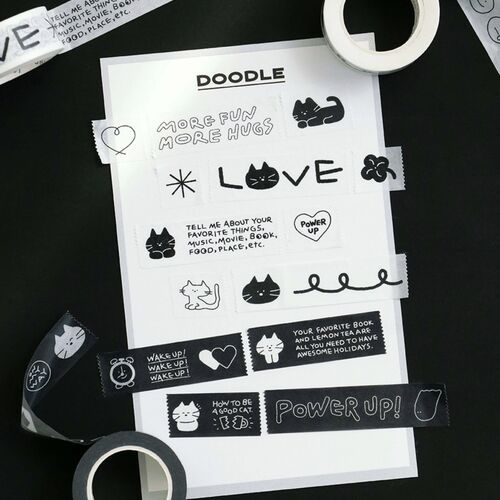 The tape features adorable black and white doodle illustrations, including cats, hearts, and stars, arranged on a white background with a playful aesthetic.