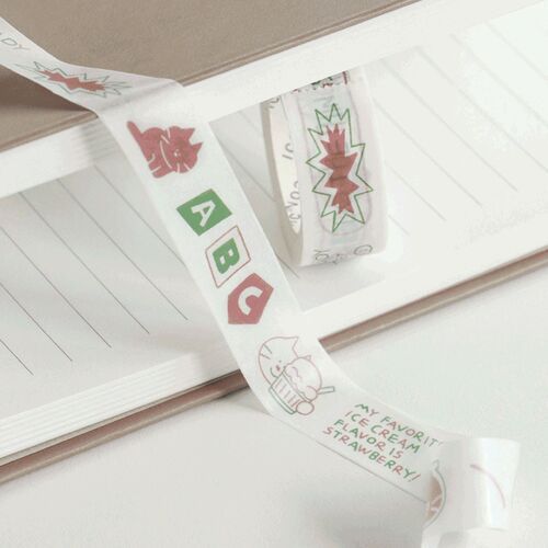 A playful close-up of the masking tape roll reveals adorable doodle illustrations in soft pastel colors, emphasizing its cute and colorful aesthetic.