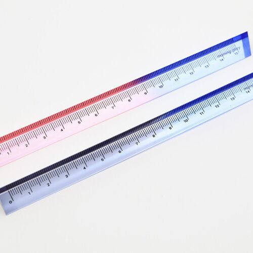 Two colorful, transparent triangular rulers with gradient hues of pink and blue, neatly aligned on a white surface, showcasing their precise measurements.