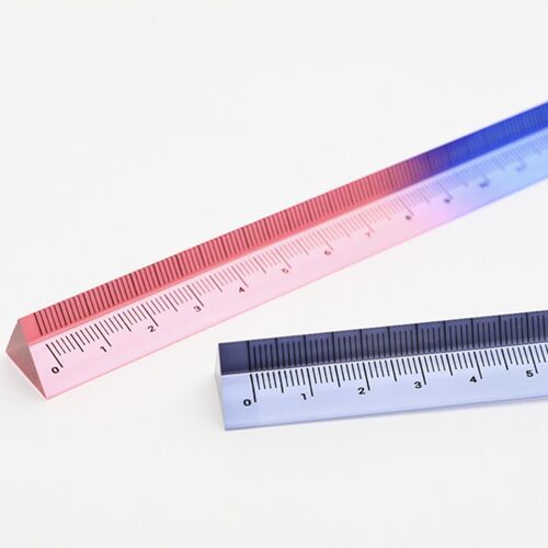 The image showcases two transparent triangular rulers in pink and blue gradient colors, positioned diagonally on a white background, highlighting their clarity and design.