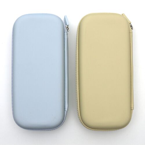 Two pastel-colored Happy Weekend Hard Pen Cases with plush patches, zipper closures, and divided interiors are displayed on a white background.