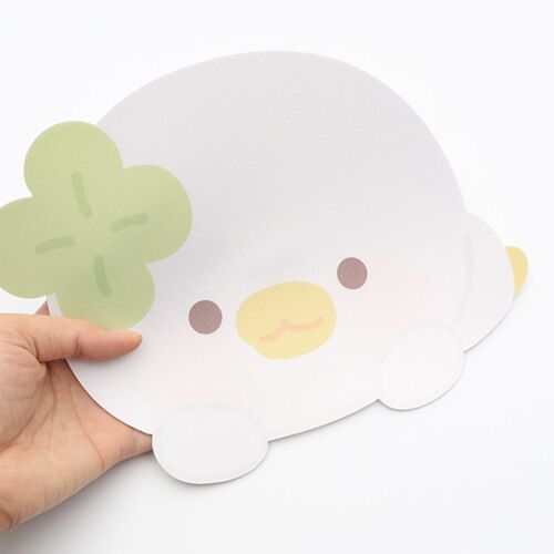 A playful, pastel-colored Lucky Duck mouse pad with a soft, textured surface and adorable, simple illustration, held in a person's hand.