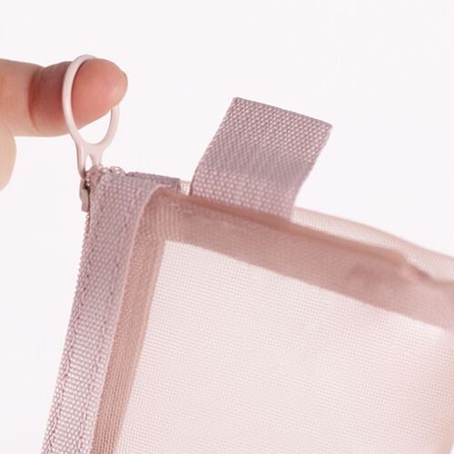 A soft pink mesh pen pouch with a close-up view of the zipper pull, showcasing its lightweight, breathable material and minimalist design.