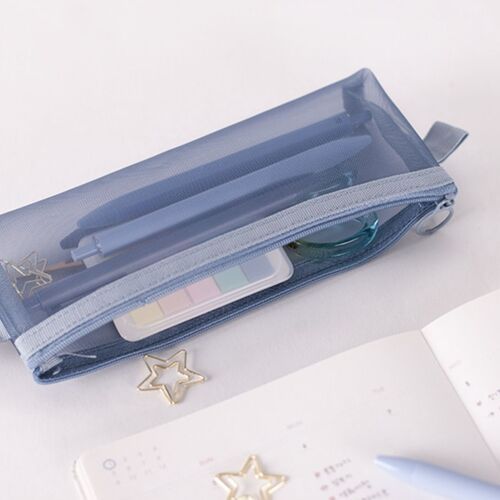 A light blue, semi-transparent mesh pouch with a zippered opening, containing pens and small accessories, resting on a white surface.