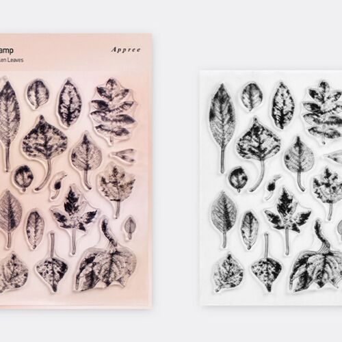 Two silicone stamp sheets display detailed, nature-inspired leaf and plant designs, with one sheet in soft pink packaging and the other in clear view.