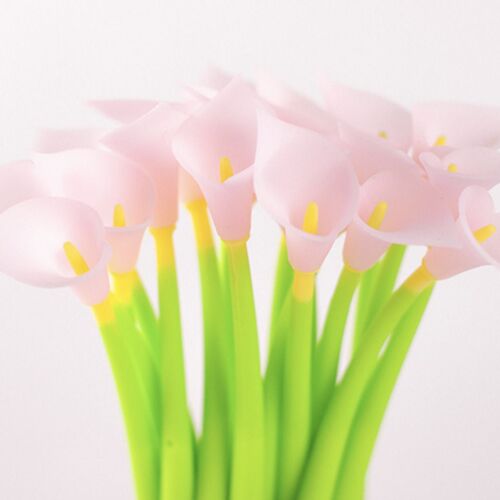 A cluster of soft pink calla lilies with bright yellow centers, set against a clean white background, emphasizing delicate floral details.
