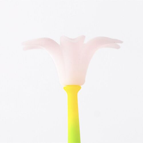 A delicate pastel pink flower-shaped silicone head atop a bright yellow stem, set against a clean white background, emphasizing playfulness.