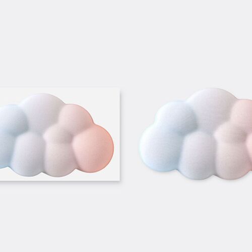 The wrist cushion features a soft, cloud-shaped design with a pastel sunset gradient, emphasizing its plush texture and calming aesthetic.