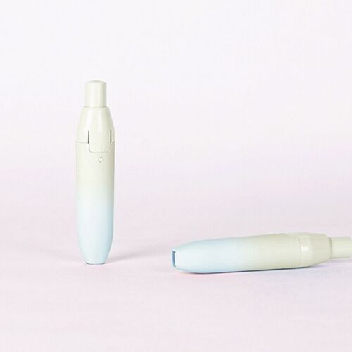 The correction tape features a soft pastel gradient from light blue to pale yellow, with a sleek, compact design ideal for handheld use.