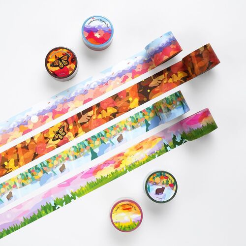 Vivid Seattle scenery masking tapes feature colorful, detailed landscape illustrations with seasonal elements, arranged in a layered display.