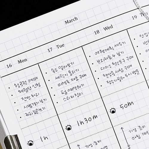 Grid notebook pages demonstrate how the printed strips align naturally with structured planner layouts.