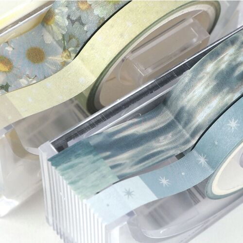 A gridded notebook presents Shimmering Ocean pieces in layered bands, highlighting the tape’s translucent finish.