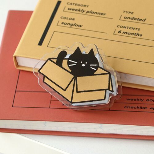 A Book clip marks a Polaroid-style photo, showing how the design stays visible while holding a page.