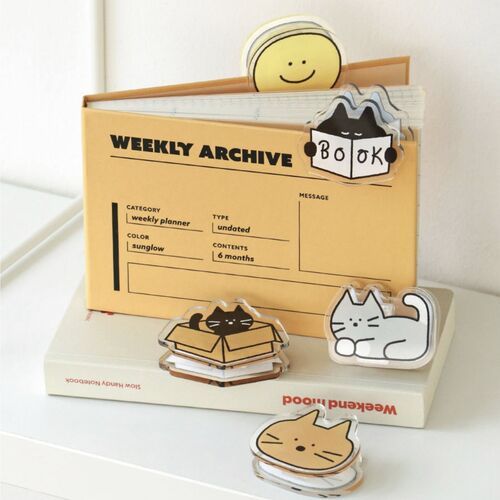 Several styles are stacked and placed on stationery, revealing their clear edges and the artwork printed on both sides.