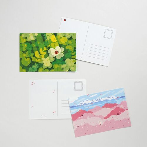 The flower-and-ladybug design appears beside its plain writing side, with horizontal lines and a clearly outlined stamp area.