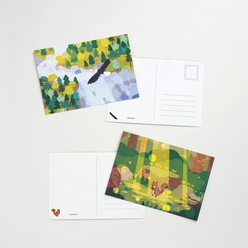 A mountain meadow design and an orca lakeside scene show their matching reverse sides with small decorative wildlife icons.