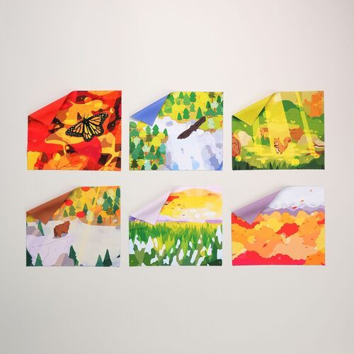 A second selection displays forest, mountain, pink blossom, butterfly, woodland, and autumn scenery across several bright cloth fronts.