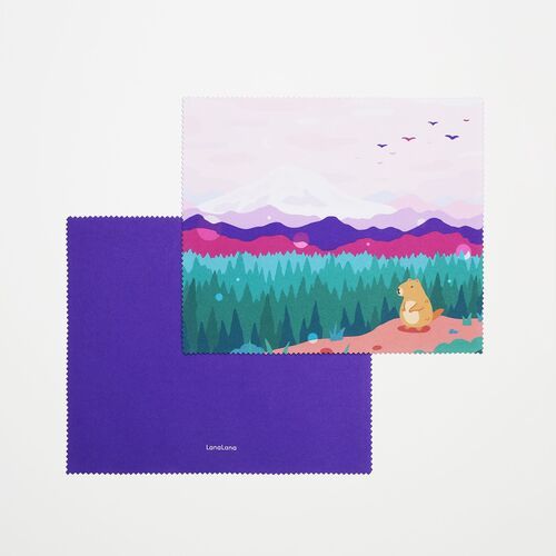 The purple mountain-and-forest design is layered over its solid purple reverse, making the double-sided construction easy to see.