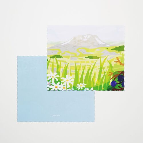 A pale mountain meadow scene features grasses, daisies, and berries while its light blue reverse extends beneath it.