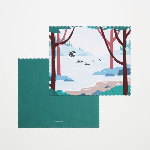 The lakeside design shows orcas between trees and distant water, paired with a coordinating deep teal reverse.