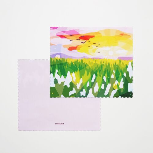 A sunset landscape combines yellow skies, distant birds, and green meadow shapes with a light lavender reverse.