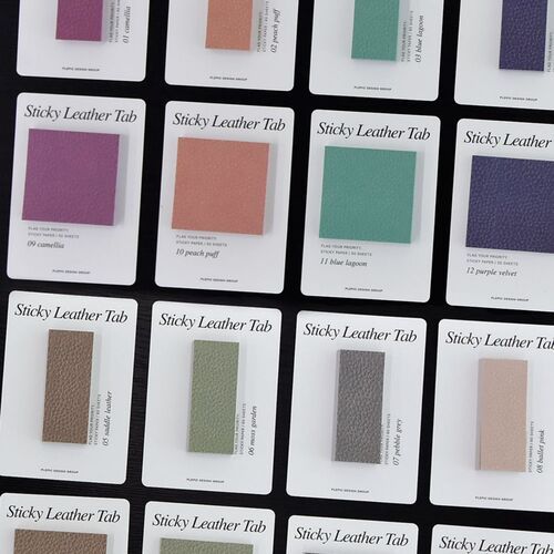 A selection of Bar cards rests beside a book and pen, presenting the slim format as a tidy page-indexing option.
