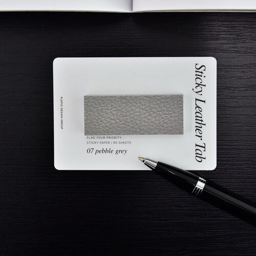 Pebble Gray packaging identifies the Bar style, while a pen rests nearby on the dark wood surface.