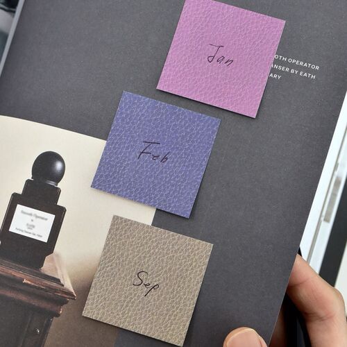 Saddle Leather Square and Pebble Gray Square cards overlap slightly, highlighting the textured color surfaces.