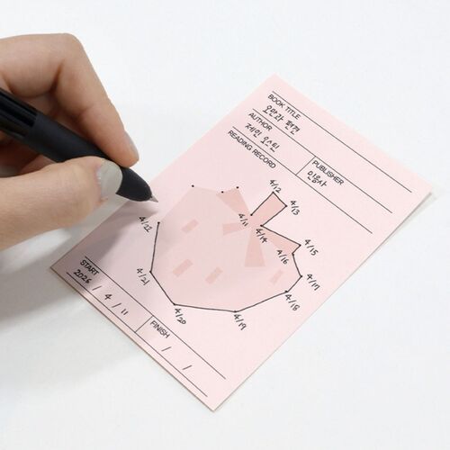 A hand connects numbered dots on the pink bookmark, demonstrating how the picture develops during a reading session.