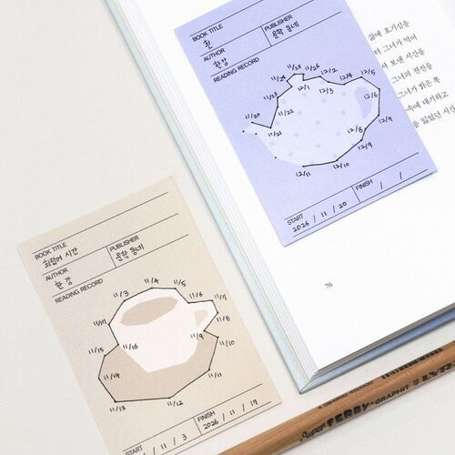 A blue house bookmark is tucked into an open book, while the pastel page marker extends above the text.