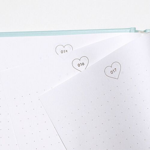A Mint journal opens to dotted pages with heart-shaped markers labeled 015, 016, and 017.