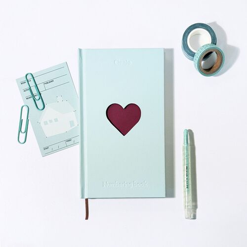 The Mint cover is styled with paper clips, memo cards, washi tape, and a pen for a planning setup.