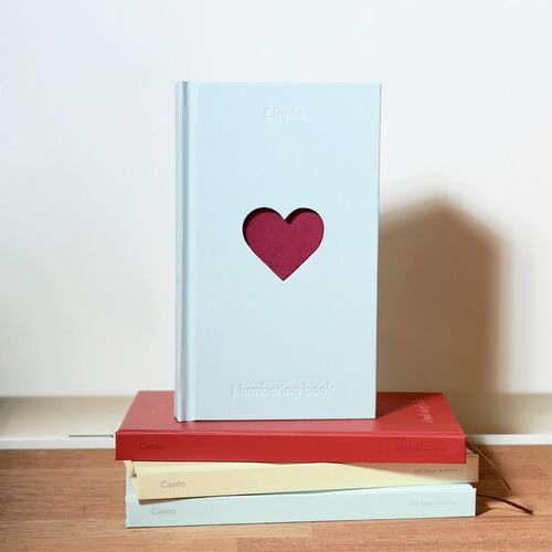 A close view of Butter shows a cat photo personalized inside the heart-shaped cover window.