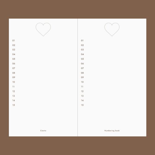 The Mint journal is photographed with its cover raised, revealing the deep heart-shaped window detail.