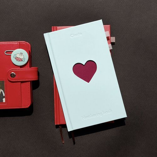 The Butter journal lies open with a large decorated travel entry and handwritten schedule notes.